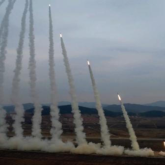 North Korean leader Kim oversees test-launch of multiple rocket launchers