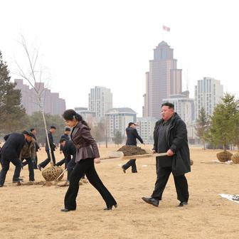 North Korean leader Kim Jong Un and his daughter Kim Ju Ae plant a tree at Saebyeol Street Pond Park, in Pyongyang