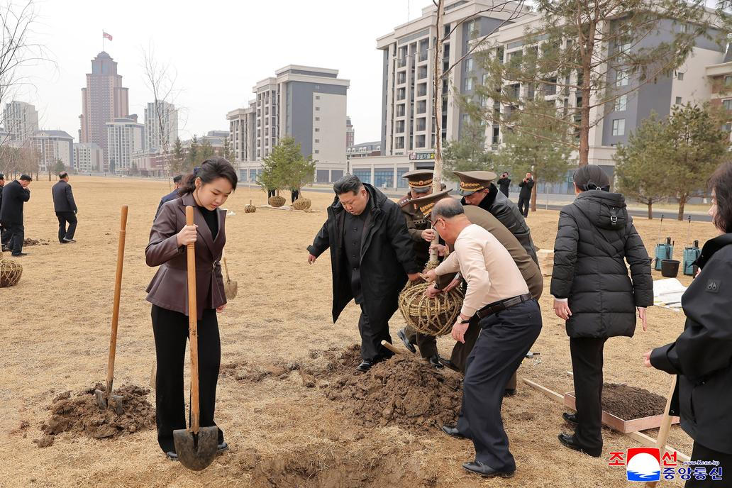 North Korean leader Kim Jong Un and his daughter Kim Ju Ae plant a tree at Saebyeol Street Pond Park, in Pyongyang