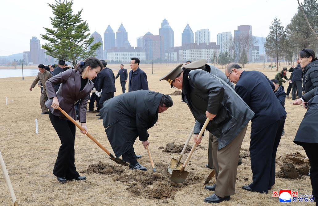 North Korean leader Kim Jong Un and his daughter Kim Ju Ae plant a tree at Saebyeol Street Pond Park, in Pyongyang