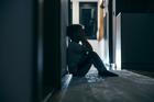Side,View,Of,A,Lonely,Child,Sitting,In,A,Dark