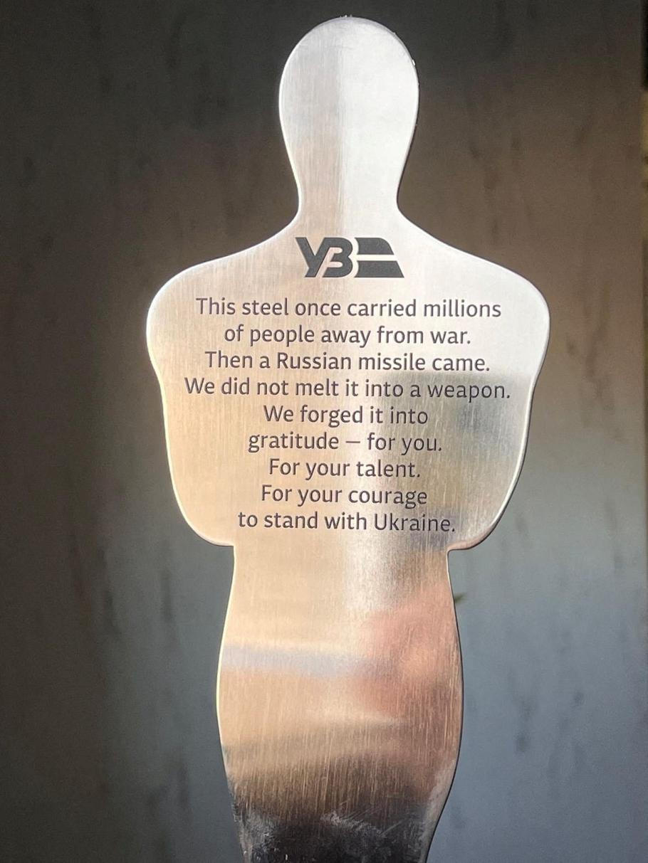 An award given to actor Sean Penn by Oleksandr Pertsovskyi in this picture obtained from social media