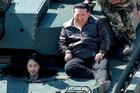 North Korean leader Kim Jong Un supervises what North Korean state news agency KCNA reports is an offensive tactical drill involving a new type of tank, at a training base in Pyongyang