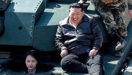 North Korean leader Kim Jong Un supervises what North Korean state news agency KCNA reports is an offensive tactical drill involving a new type of tank, at a training base in Pyongyang