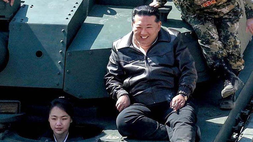 North Korean leader Kim Jong Un supervises what North Korean state news agency KCNA reports is an offensive tactical drill involving a new type of tank, at a training base in Pyongyang