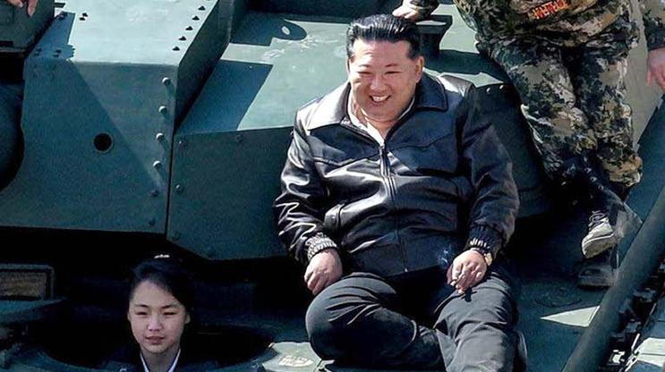 North Korean leader Kim Jong Un supervises what North Korean state news agency KCNA reports is an offensive tactical drill involving a new type of tank, at a training base in Pyongyang