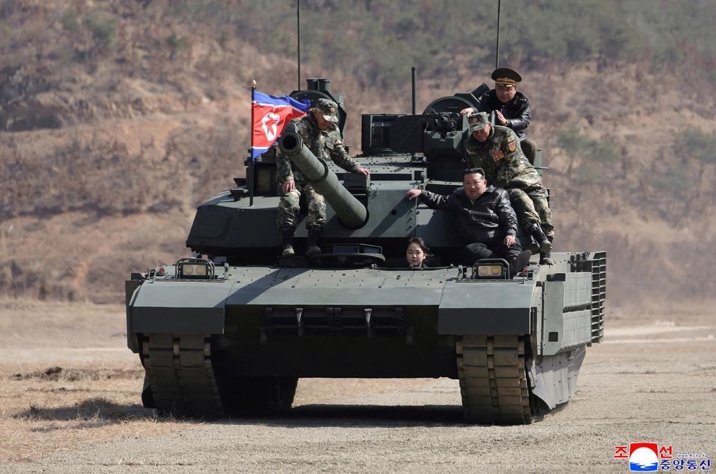 North Korean leader Kim Jong Un supervises what North Korean state news agency KCNA reports is an offensive tactical drill involving a new type of tank, at a training base in Pyongyang
