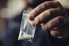 Man,Hand,Holds,Plastic,Packet,Or,Bag,With,Cocaine,Or