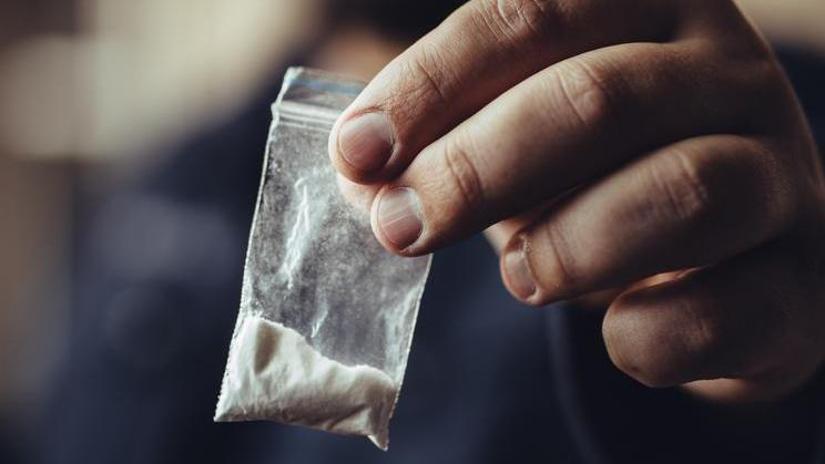 Man,Hand,Holds,Plastic,Packet,Or,Bag,With,Cocaine,Or