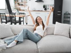 Apartment,,Woman,And,Happy,In,Portrait,On,Sofa,With,Peaceful,