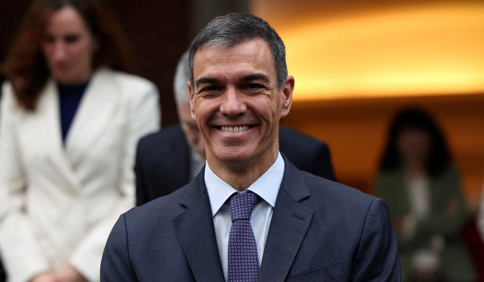 FILE PHOTO: Spain's PM Sanchez poses with members of the government for a family photo before their last cabinet meeting of the year at Moncloa Palace in Madrid