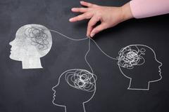 Silhouettes,Of,Human,Heads,And,A,Hand,With,Threads,,Representing