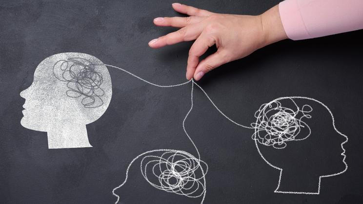 Silhouettes,Of,Human,Heads,And,A,Hand,With,Threads,,Representing