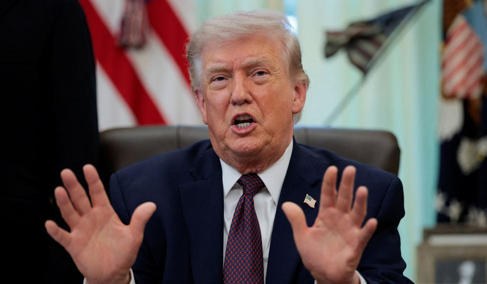 U.S. President Trump signs an executive order in the Oval Office of the White House