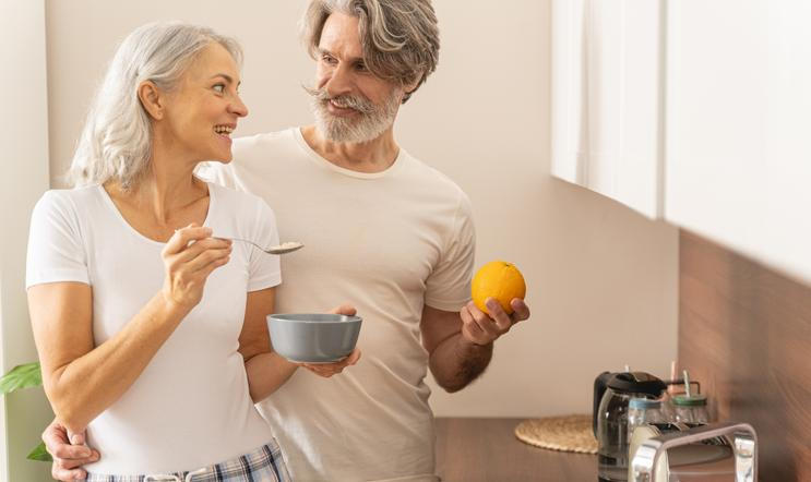 Lady,With,A,Spoon,Of,Porridge,Smiling,At,Her,Husband