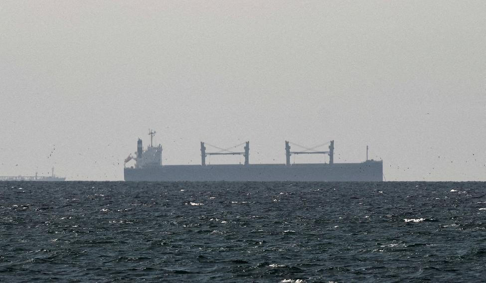 FILE PHOTO: FILE PHOTO: A cargo ship in the Gulf, near the Strait of Hormuz