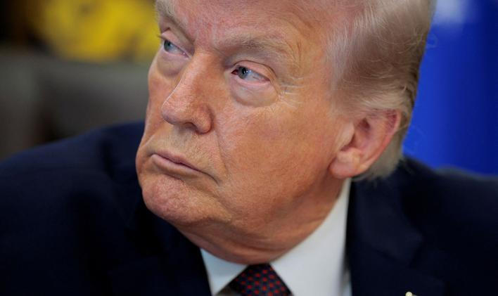 FILE PHOTO: U.S. President Trump signs an executive order in the Oval Office of the White House