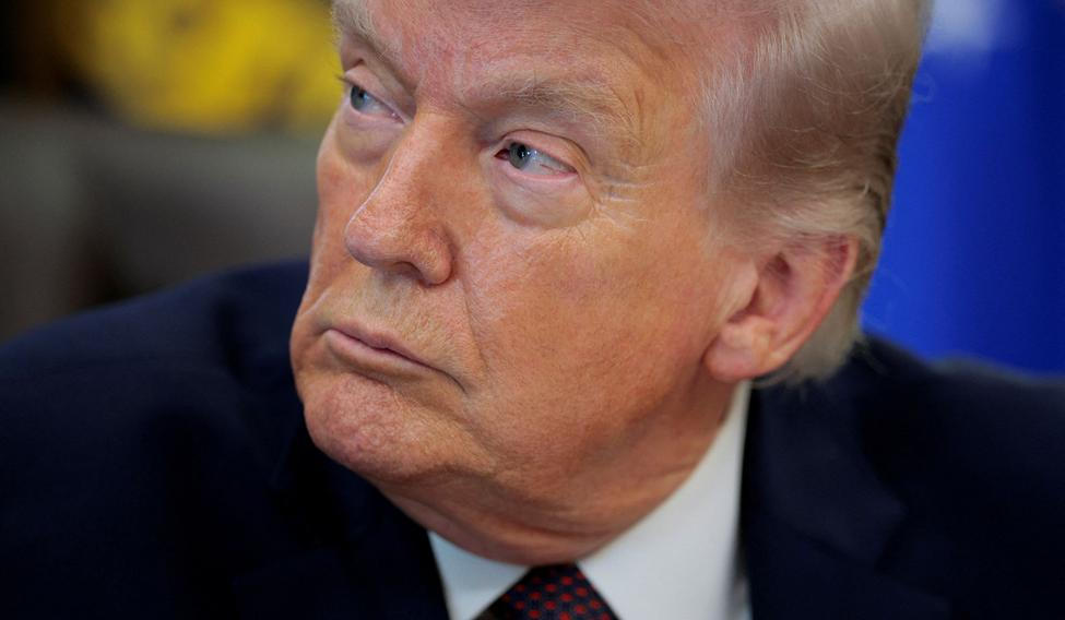 FILE PHOTO: U.S. President Trump signs an executive order in the Oval Office of the White House
