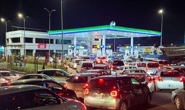 Vehicles wait for their turn to get fuel at a petrol station, as Pakistan raises fuel prices amid the U.S.-Israeli conflict with Iran, in Islamabad