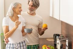 Lady,With,A,Spoon,Of,Porridge,Smiling,At,Her,Husband