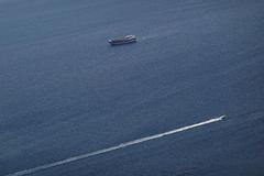Boats in the Strait of Hormuz amid the U.S.-Israeli conflict with Iran, as seen from Musandam