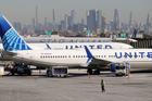 FILE PHOTO: United Airlines planes prepare to take off at Newark Liberty International Airport in Newark