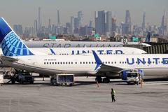 FILE PHOTO: United Airlines planes prepare to take off at Newark Liberty International Airport in Newark