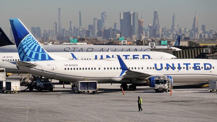 FILE PHOTO: United Airlines planes prepare to take off at Newark Liberty International Airport in Newark
