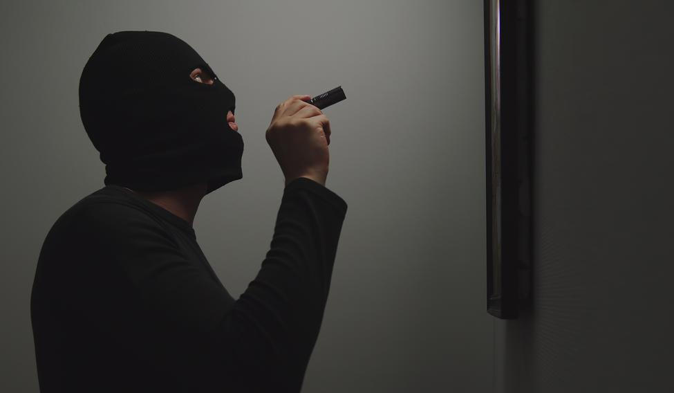 Thief,Climbs,Into,The,House,,Shines,A,Flashlight,On,The