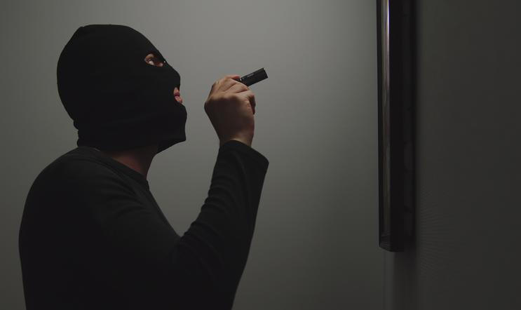 Thief,Climbs,Into,The,House,,Shines,A,Flashlight,On,The