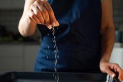 Woman,Salts,Food,With,A,Pinch,Of,Salt,At,The
