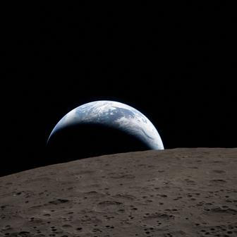 FILE PHOTO: A view of Earth, partially hidden behind the Moon, captured through the Orion spacecraft window