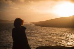 A,Back,View,Of,Human,Standing,And,Looking,To,Sea
