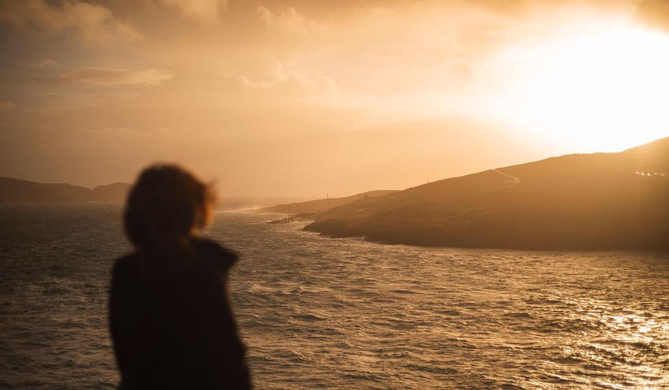A,Back,View,Of,Human,Standing,And,Looking,To,Sea