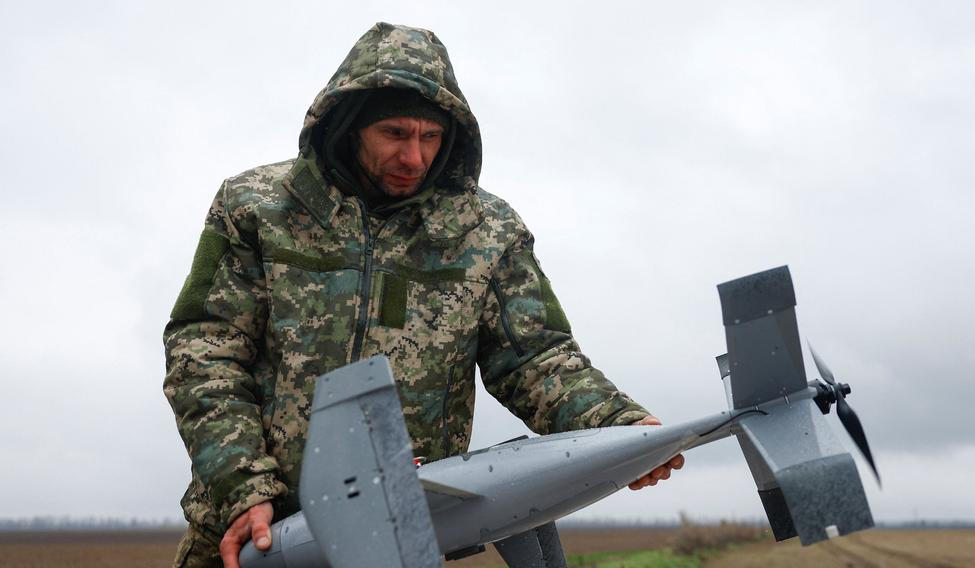 Ukrainian serviceman holds an interceptor drone, a part of MEROPS system, during a pre-flight checking at a training in an undisclosed location in Ukraine