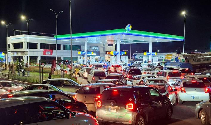 FILE PHOTO: Vehicles wait for their turn to get fuel at a petrol station, as Pakistan raises fuel prices amid the U.S.-Israeli conflict with Iran, in Islamabad