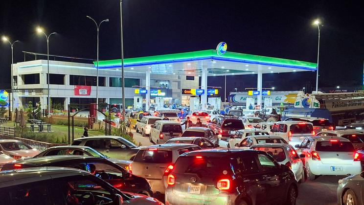 FILE PHOTO: Vehicles wait for their turn to get fuel at a petrol station, as Pakistan raises fuel prices amid the U.S.-Israeli conflict with Iran, in Islamabad