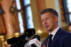 Hungary's election winner Magyar talks to the media after talks between parties on preparations for the first session of the Parliament in Budapest