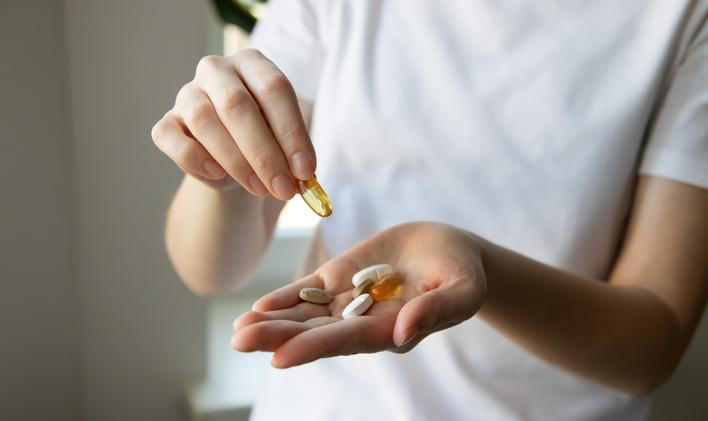 ?lose-up,Of,A,Woman's,Hands,With,Various,Pills,And,Supplements.