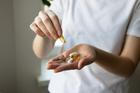 ?lose-up,Of,A,Woman's,Hands,With,Various,Pills,And,Supplements.
