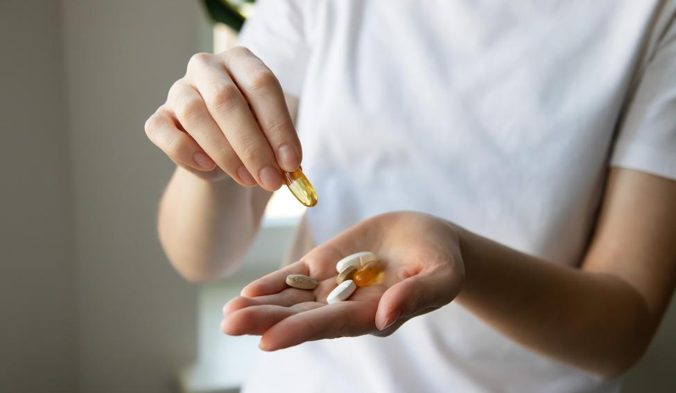 ?lose-up,Of,A,Woman's,Hands,With,Various,Pills,And,Supplements.