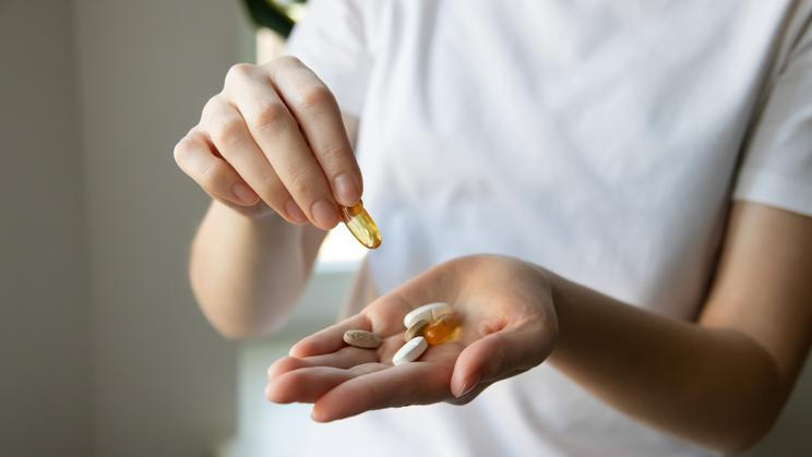 ?lose-up,Of,A,Woman's,Hands,With,Various,Pills,And,Supplements.