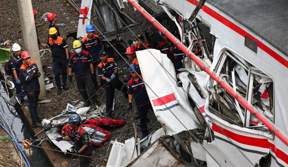 Aftermath of a deadly collision between a commuter line train and a long-distance train, in Bekasi