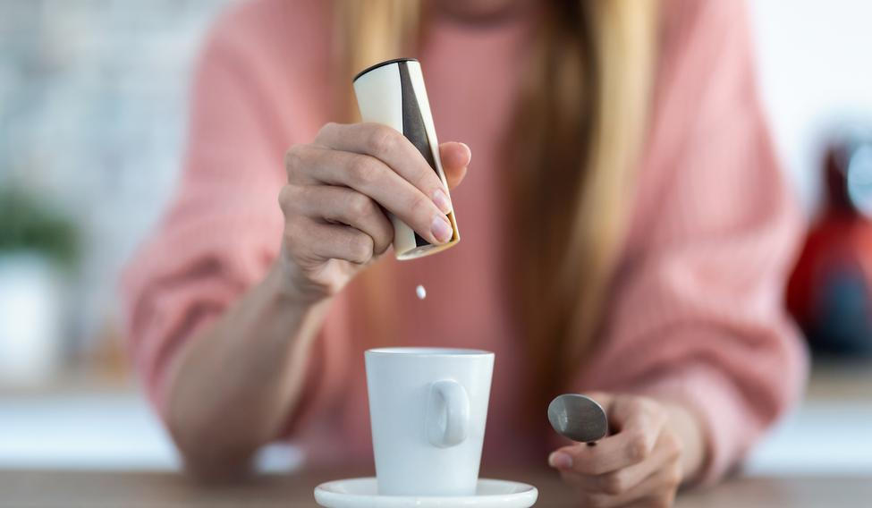 Close-up,Of,Woman,Hand,Throwing,Saccharin,Pills,On,Coffee,Cup