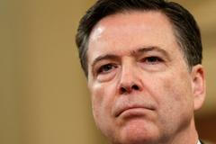 FILE PHOTO: FBI Director James Comey at House Intelligence Committee hearing in Washington