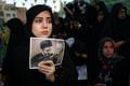 A woman holds a poster depicting Iran’s new Supreme Leader Mojtaba Khamenei, during a rally in Tehran