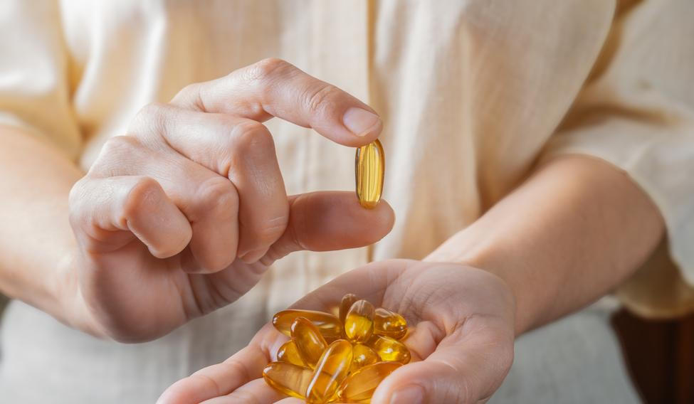 The,Woman,Holds,Omega-3,Capsules,In,Her,Hand