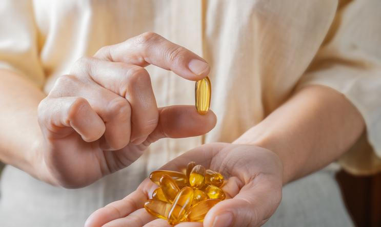 The,Woman,Holds,Omega-3,Capsules,In,Her,Hand