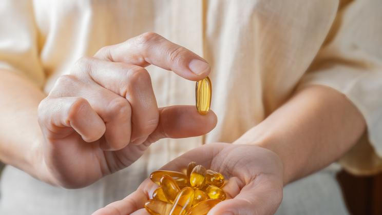 The,Woman,Holds,Omega-3,Capsules,In,Her,Hand