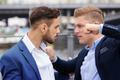 Two,Young,Businessmen,Having,A,Fight,Outside